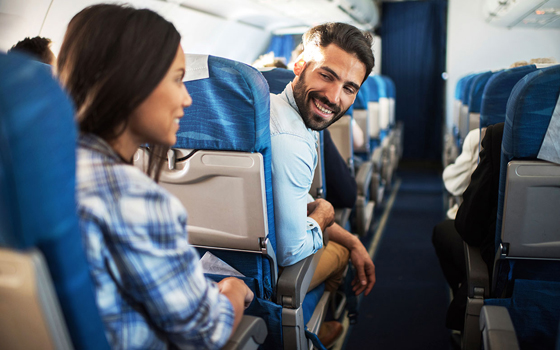 Passengers talking in airplane.