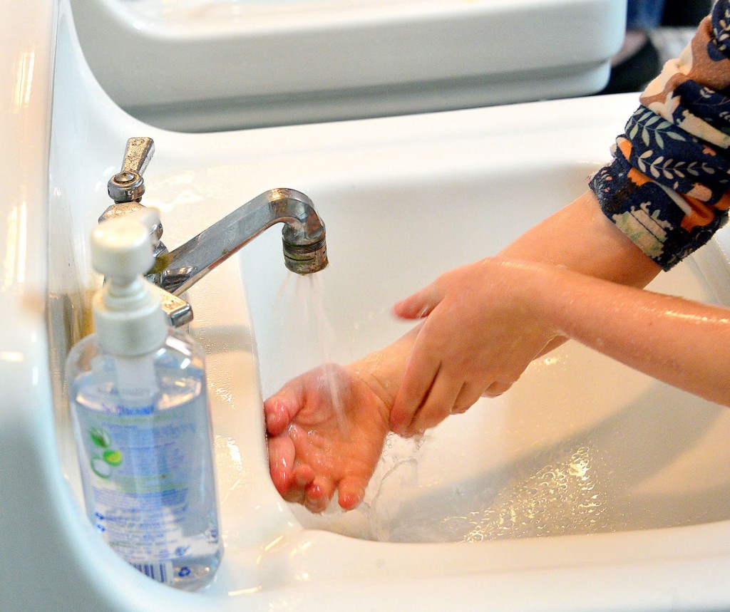 Eleanor Smallwood, 7, of Martinsburg, W.Va., practices hand-washing techniques Tuesday, February 18, 2020, during a program at Discovery Station in downtown Hagerstown, Md. (Mike Lewis/The Herald-Mail via AP)