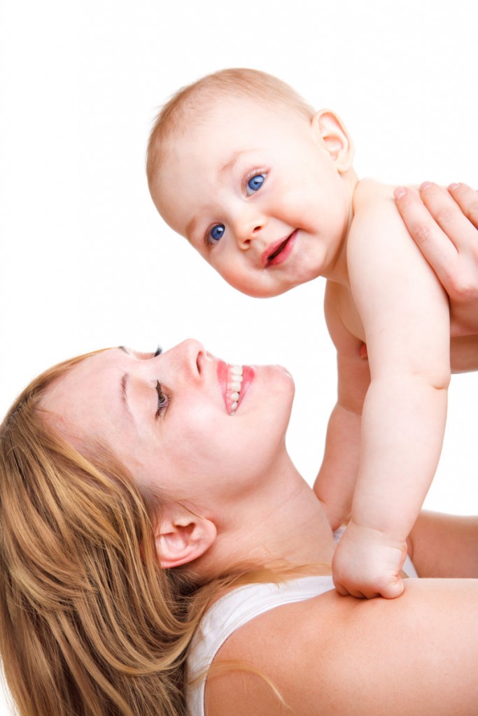 Happy mother and baby, playing,  over white