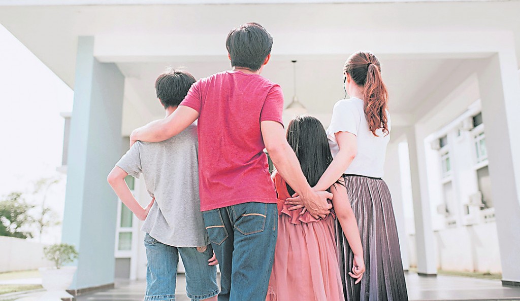 an asian chinese family moving into new house admiring their house