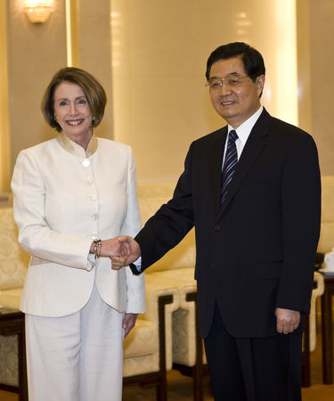 U.S. House Speaker Nancy Pelosi, left, shakes hand with Chinese President Hu Jintao during a meeting at the Great Hall of the People in Beijing, China, Wednesday, May 27, 2009. (AP Photo/Andy Wong, Pool)