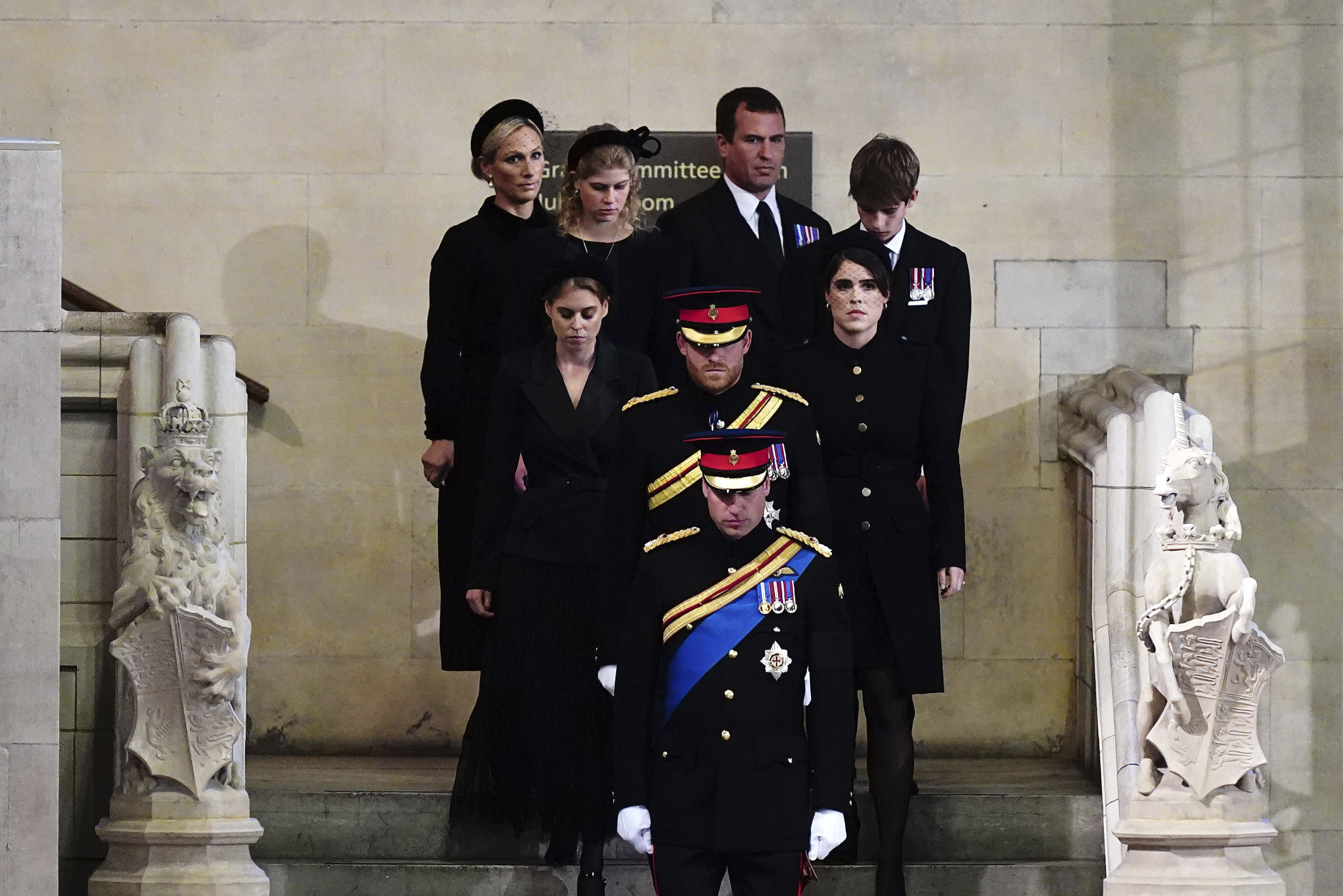 Left to right: Zara Tindall, Lady Louise, Princess Beatrice, Prince William, the prince of Wales, Prince Harry, Princess Eugenie, Viscount James Severn and Peter Phillips attend the vigil of the Queen's grandchildren around the coffin, as it lies in state on the catafalque in Westminster Hall, at the Palace of Westminster, London, Saturday,  Sept. 17, 2022, ahead of her funeral on Monday. (Aaron Chown/Pool Photo via AP)