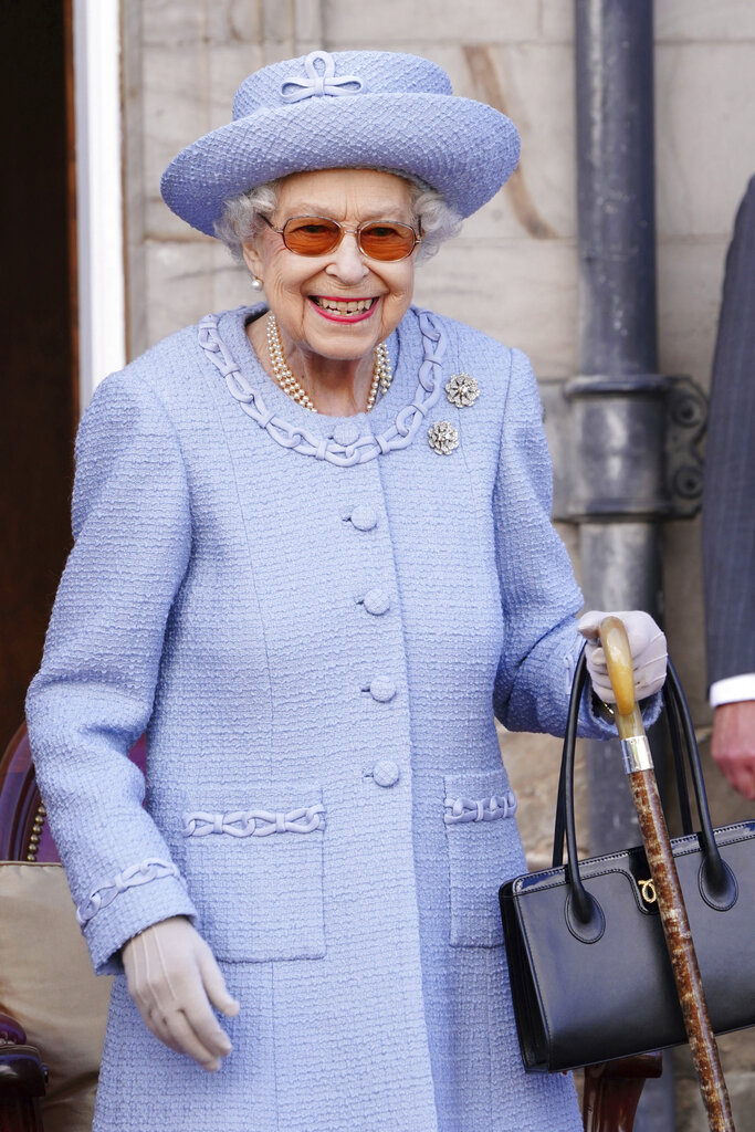 Britain's Queen Elizabeth II attends the Queen's Body Guard for Scotland (also known as the Royal Company of Archers) Reddendo Parade in the gardens of the Palace of Holyroodhouse, Edinburgh, Thursday June 30, 2022. (Jane Barlow/Pool via AP)