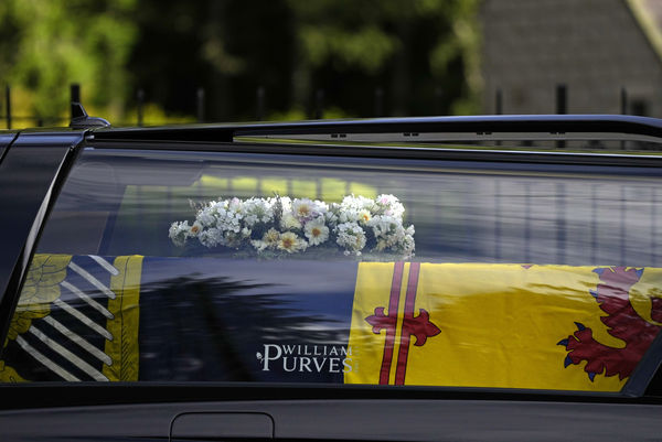 The coffin containing the body of Britain's Queen Elizabeth II leaves Balmoral Castle in Scotland, Sunday, Sept. 11, 2022. The Queen's coffin will be transported Sunday on a journey from Balmoral to the Palace of Holyroodhouse in Edinburgh, where it will lie at rest before being moved to London later in the week. (AP Photo/Alastair Grant)