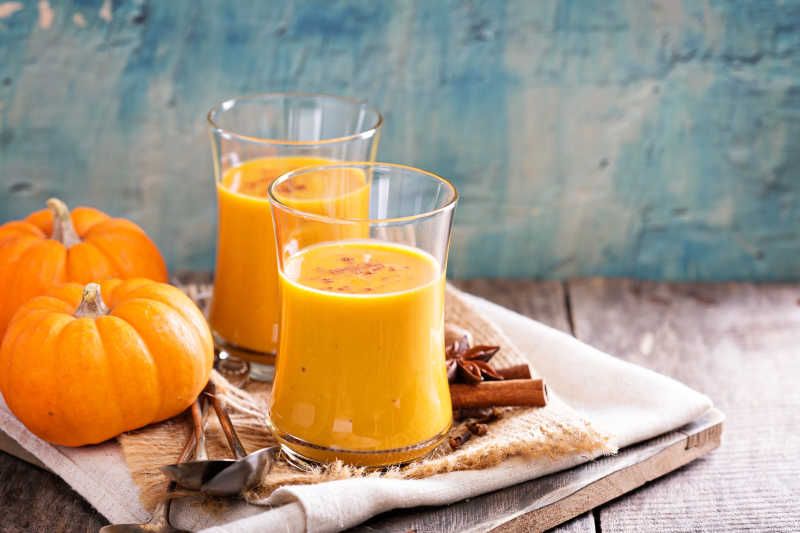 Fresh pumpkin juice with cinnamon, fall drink concept