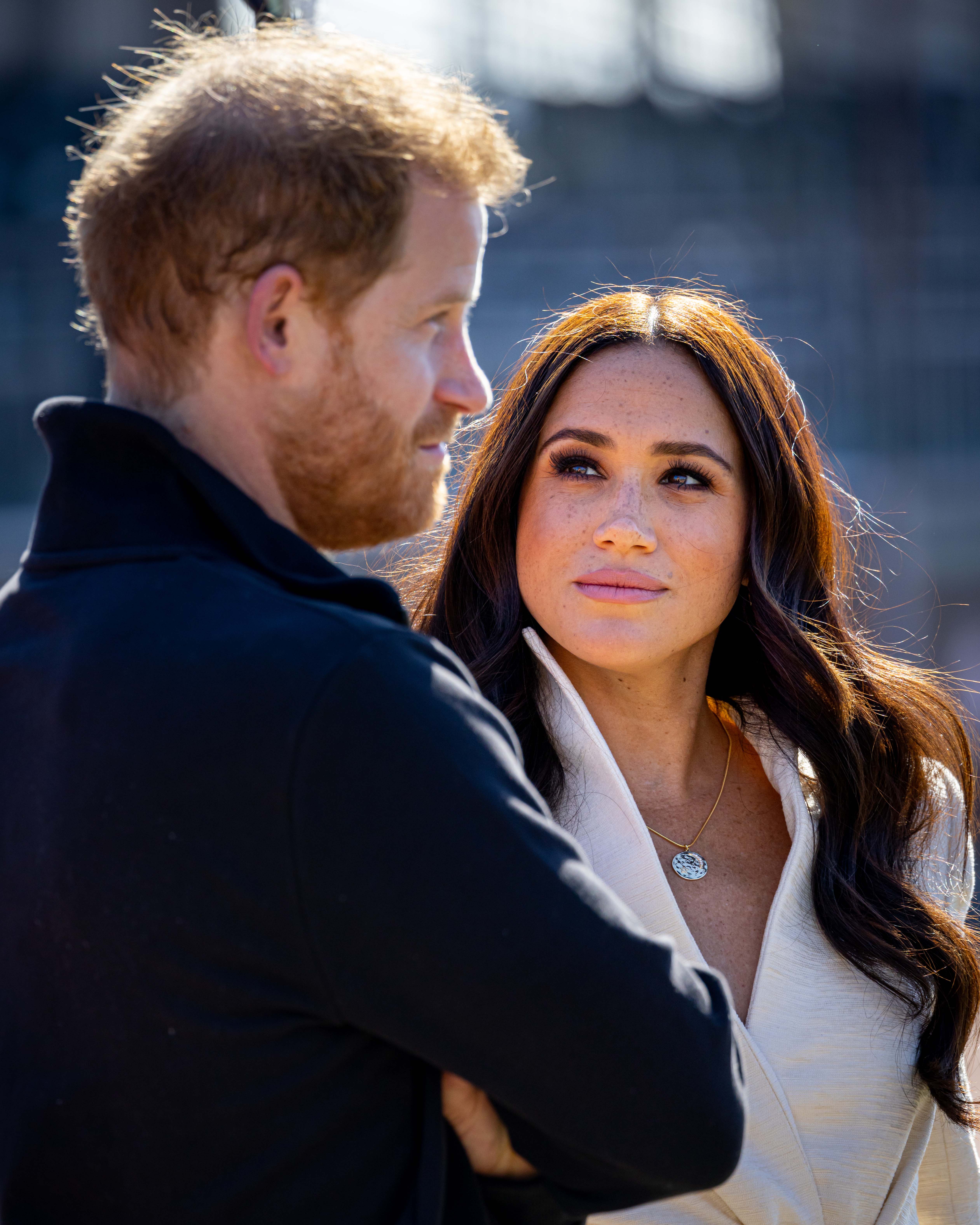 THE HAGUE, NETHERLANDS - APRIL 17: Prince Harry, Duke of Sussex and Meghan, Duchess of Sussex attend day two of the Invictus Games 2020 at Zuiderpark on April 17, 2022 in The Hague, Netherlands. (Photo by Patrick van Katwijk/Getty Images)