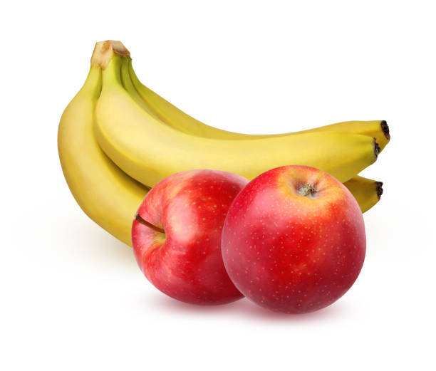 Bunch of ripe bananas and two red apples, isolated on white background with shadow. The whole fruit.