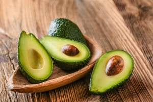 Avocado,On,Old,Wooden,Table.halfs,On,Wooden,Bowl.,Fruits,Healthy