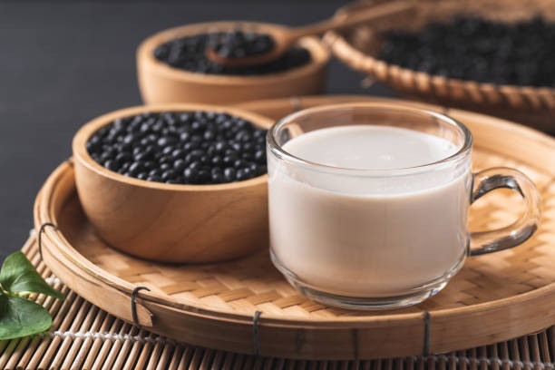 Black soy bean seeds and soy milk in a cup glass, Healthy drink