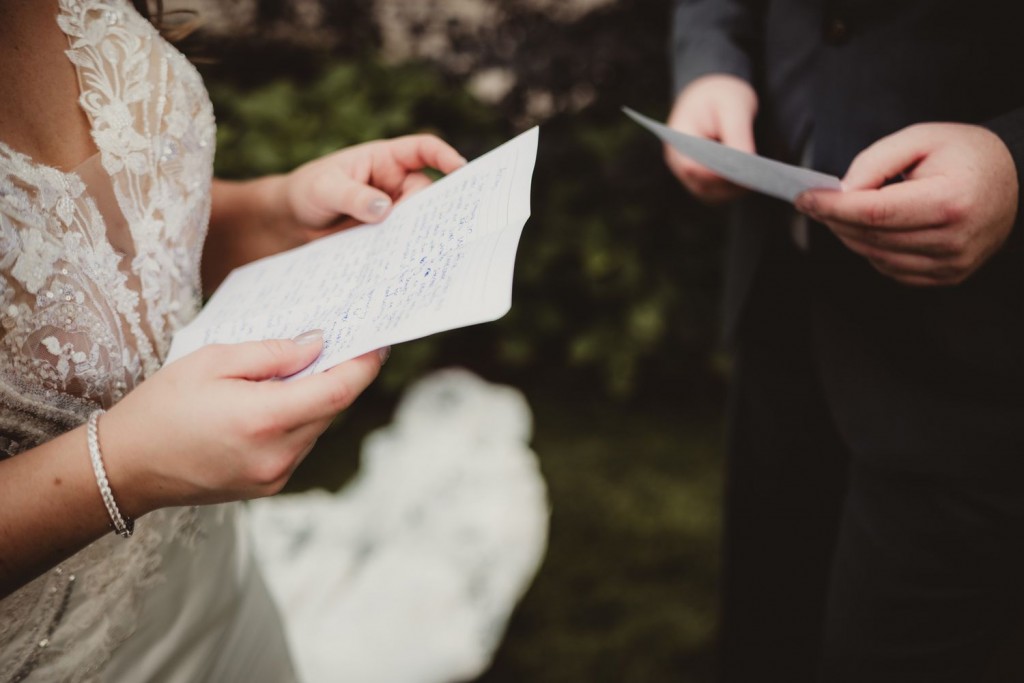 bride-groom-exchanging-vows-021224-8f0a366107d1481aac9fdb4487fd1019