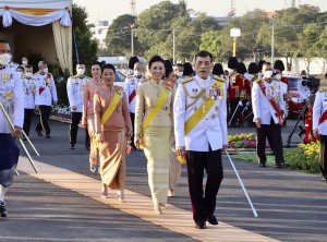 Thailand's King Maha Vajiralongkorn followed by his wife Queen Suthida, and daughters Princess Bajrakitiyabha, centre left and Princess Sirivannavari, background and members of the Royal Noble Consort Sineenat, attend a foundation stone-laying ceremony for a monument to be erected in honor of his late father King Bhumibol Adulyadej in Bangkok, Thailand Sunday, Dec. 5, 2021. (Matichon Newspaper, Pool Photo via AP)
