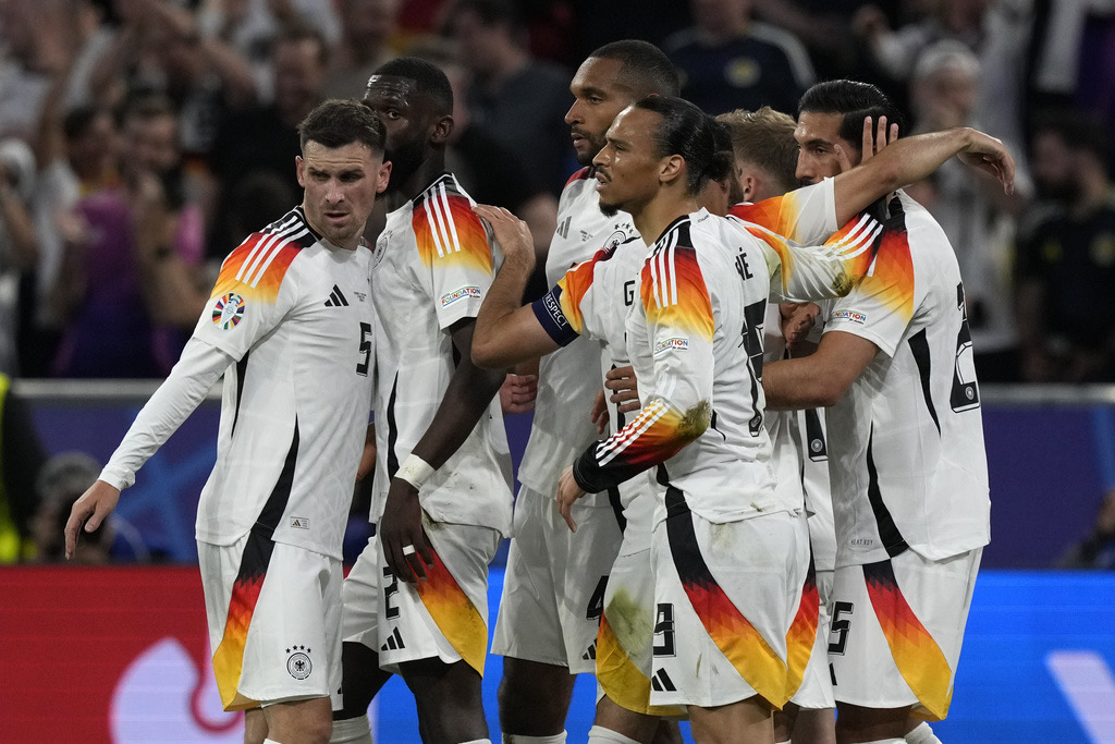 Germany's Emre Can, right, is celebrated after he scored his side's 5th goal during a Group A match between Germany and Scotland at the Euro 2024 soccer tournament in Munich, Germany, Friday, June 14, 2024. (AP Photo/Frank Augstein)