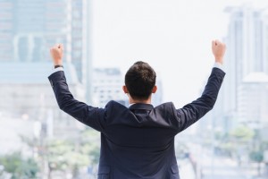 Celebrating,Success.,Back,View,Of,Excited,Young,Asian,Businessman,Arms