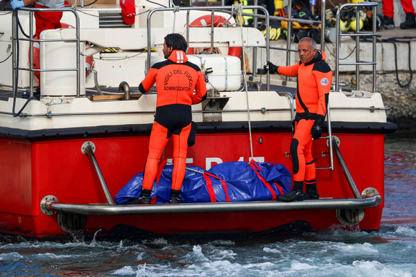 Rescue personnel transport a body bag after a luxury yacht, which was carrying British entrepreneur Mike Lynch, sank off the coast of Porticello, near the Sicilian city of Palermo, Italy, August 21, 2024. REUTERS/Louiza Vradi     TPX IMAGES OF THE DAY